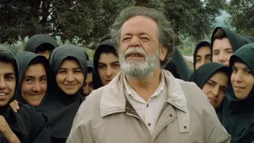 Backdrop to the movie "Through the Olive Trees" #457602